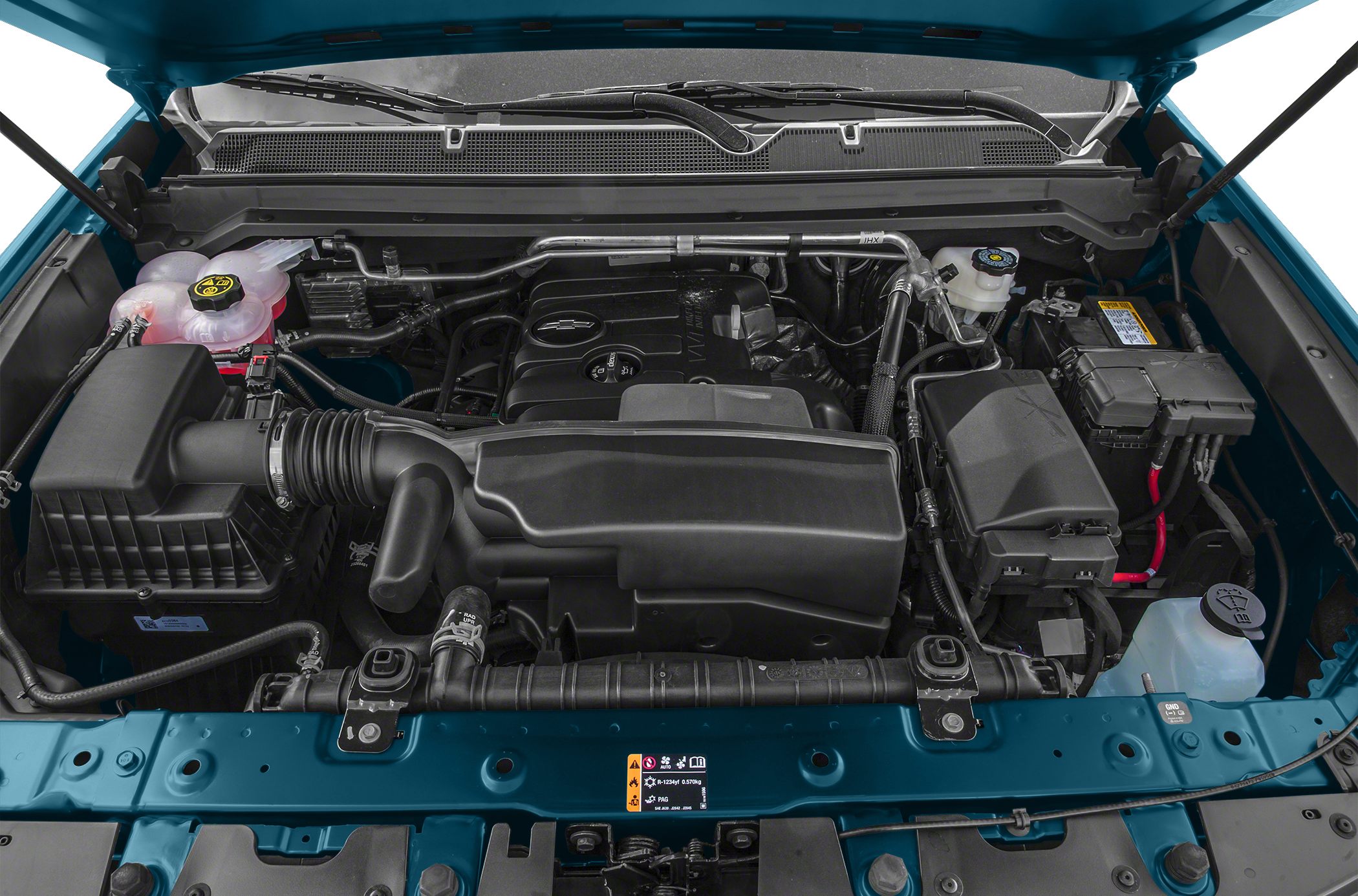 Engine bay with intake, battery, fluid reservoirs, and components