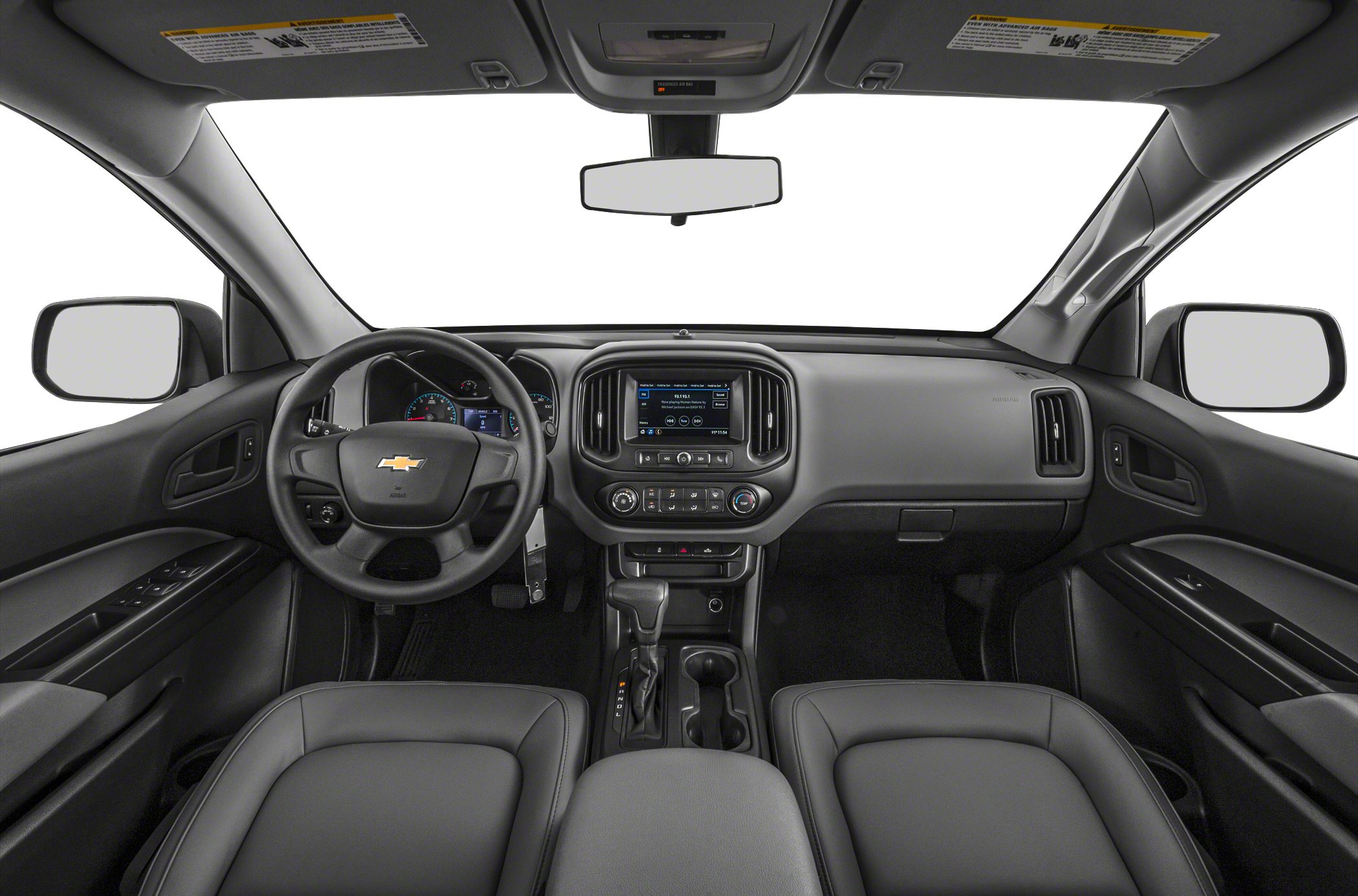 Dashboard view with steering wheel, center console, and seats inside pickup interior