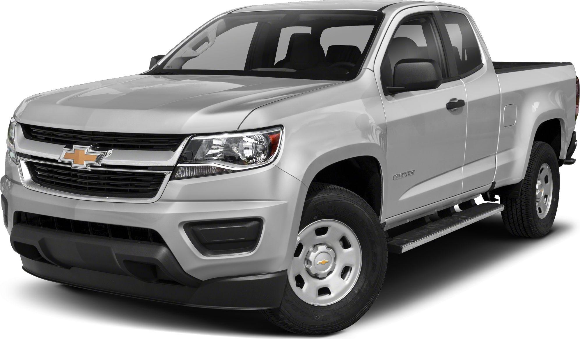 Front angled view of extended cab pickup with long box and side step bar
