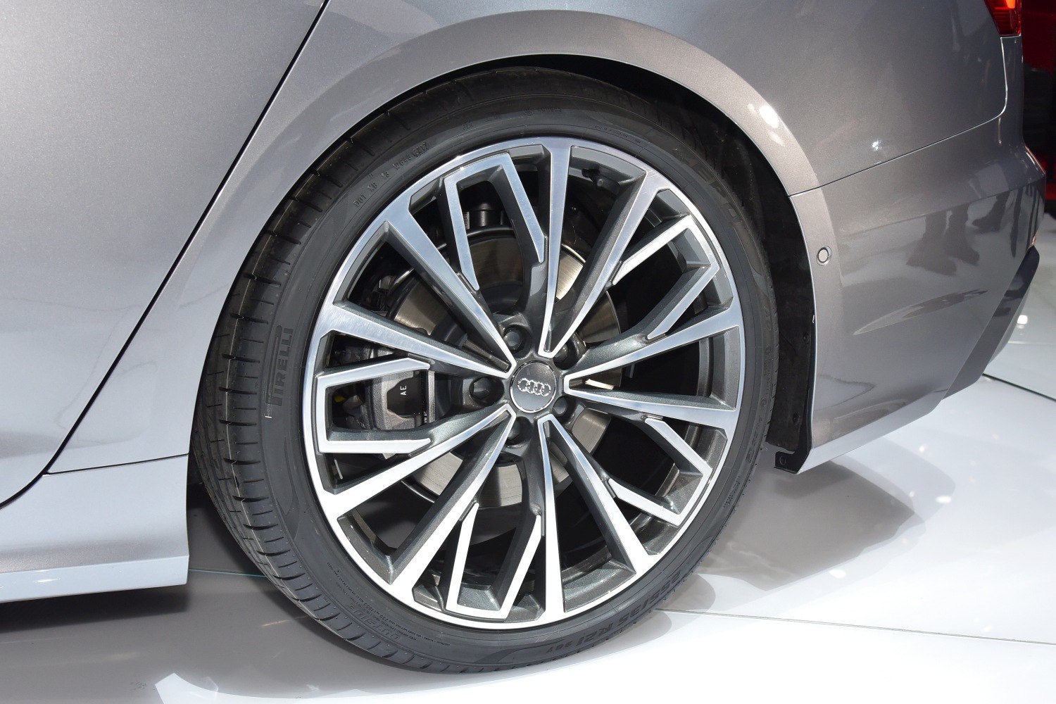 Multi-spoke alloy wheel with brake disc and rear fender segment