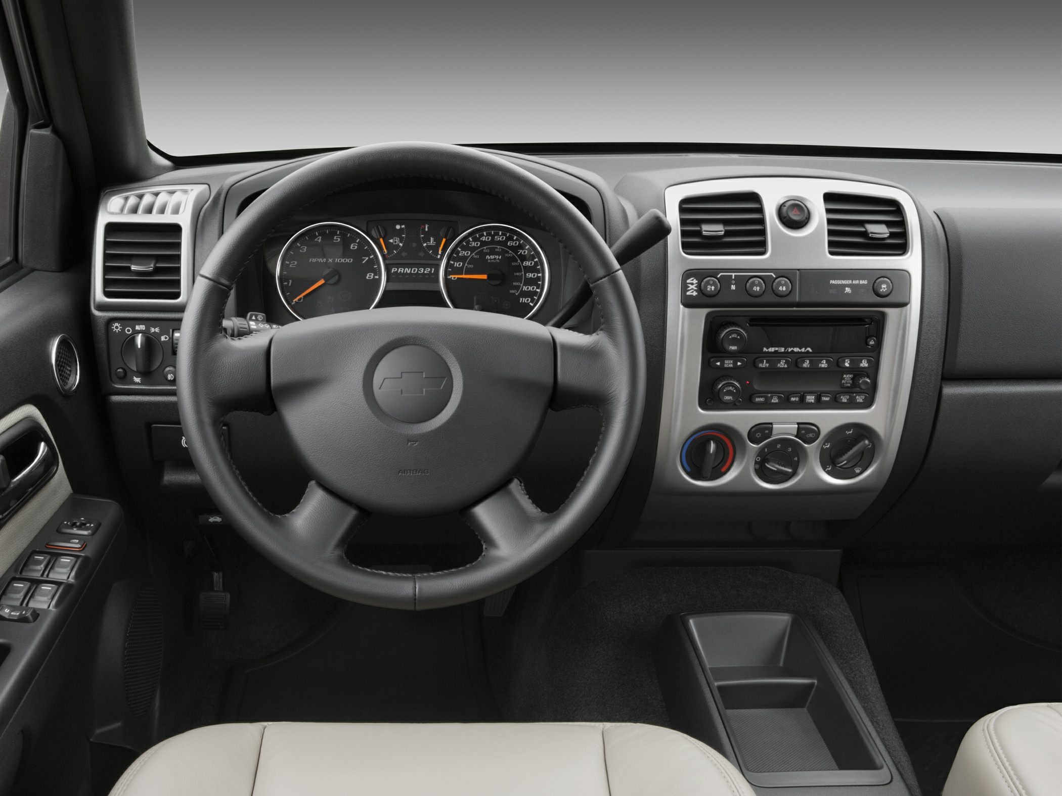 Steering wheel, dashboard gauges, and center console controls