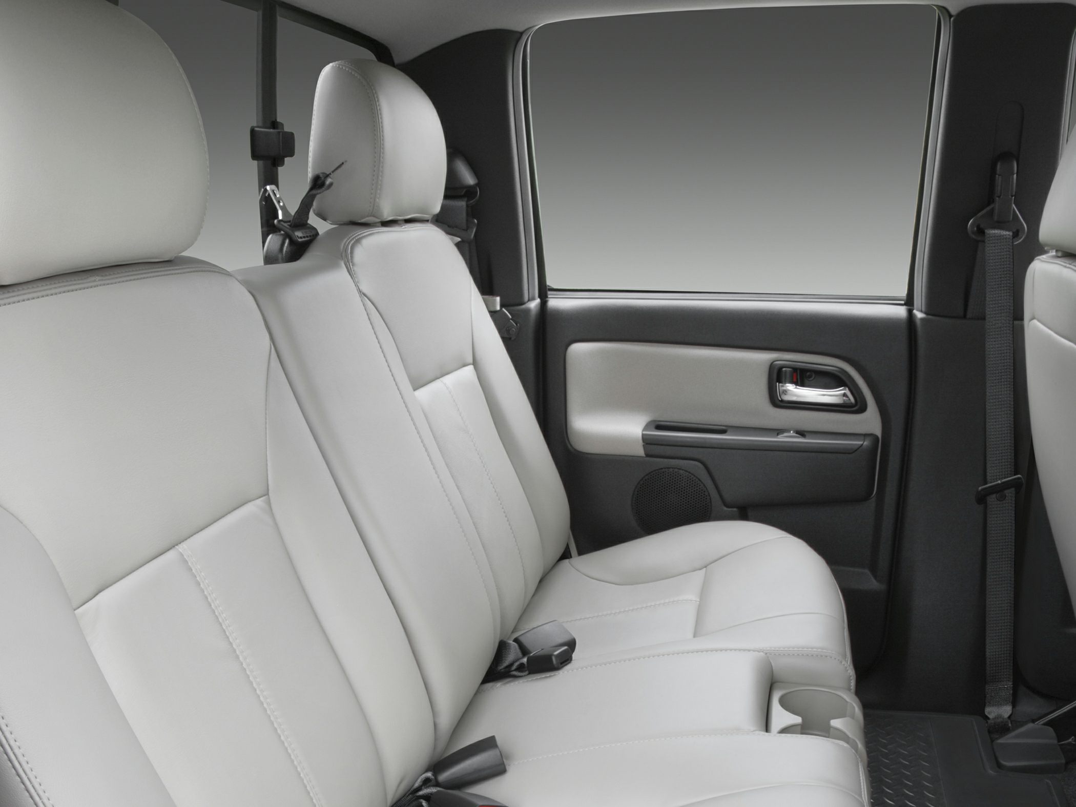 Rear light leather seats with headrests and door panel with handle and speaker