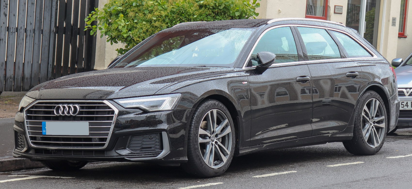 Front-side profile of modern wagon with sharp headlights and alloy wheels