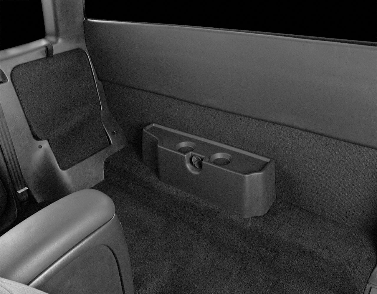 Rear interior upholstery with carpeted floor and cup holders