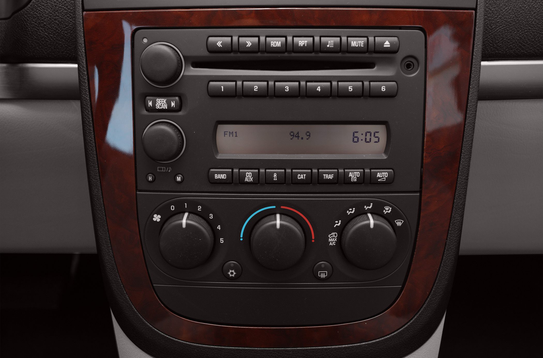 Car radio system and manual climate control knobs with wood trim