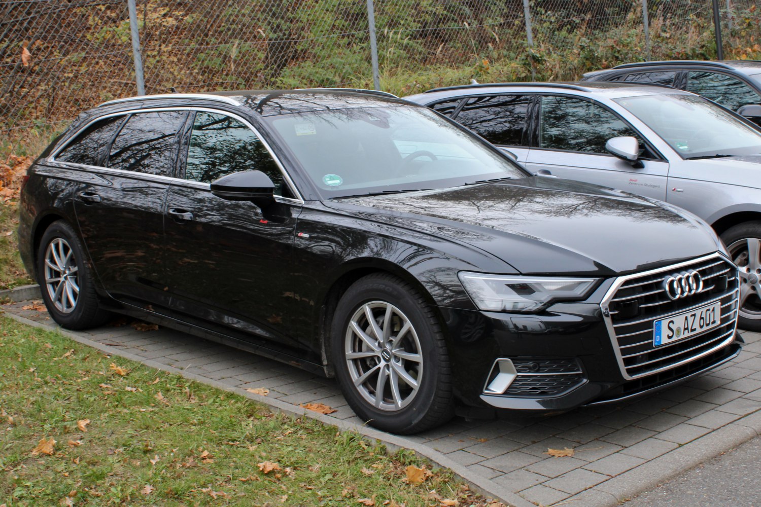 Black luxury station wagon with sleek front grille and LED headlights