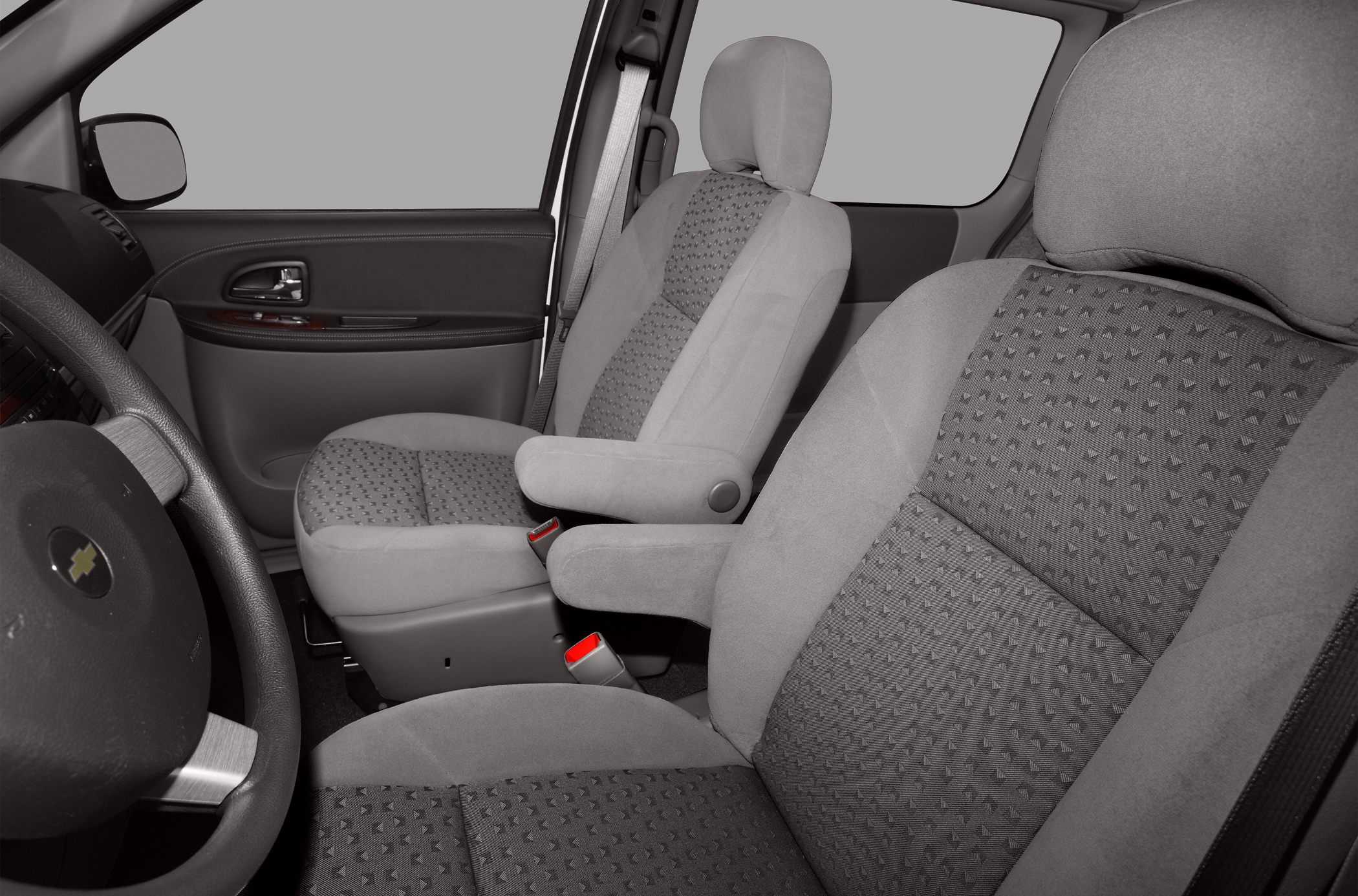 Front seats with fabric upholstery and dashboard interior in close-up view