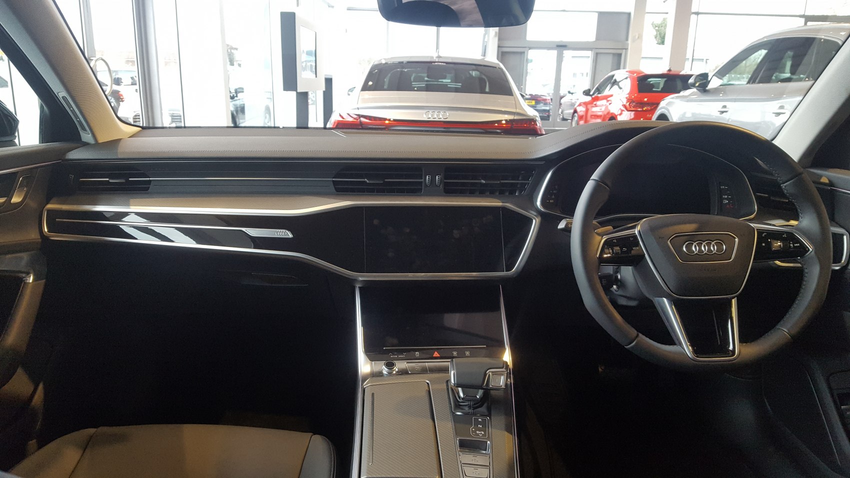 Modern dashboard and steering wheel with center console in a luxury vehicle