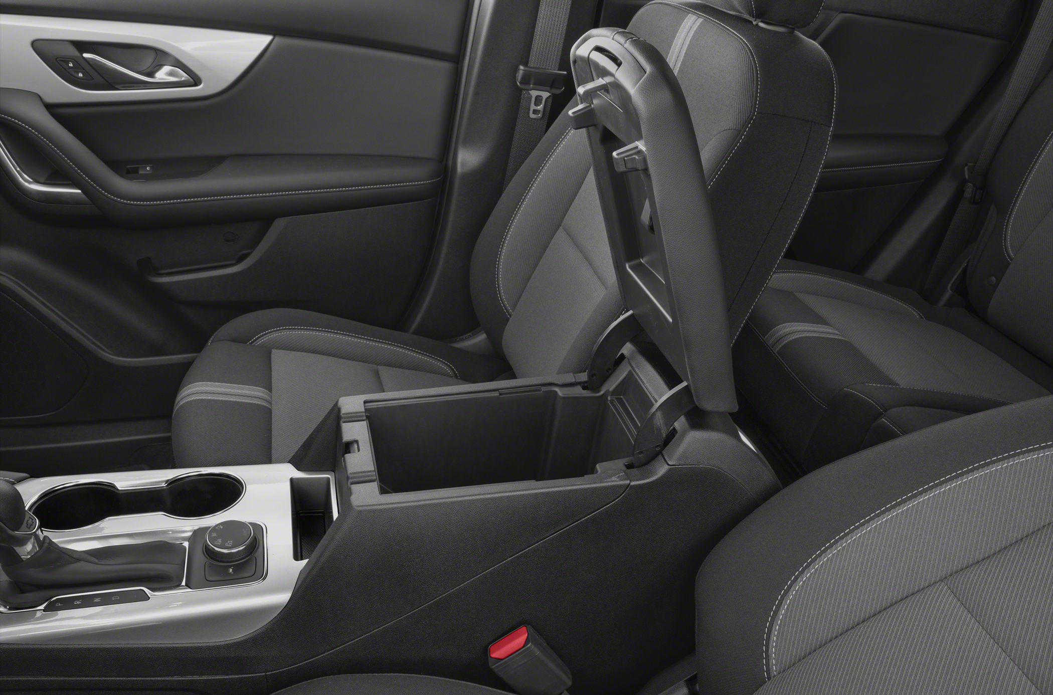 Open center console storage compartment with modern front seats interior