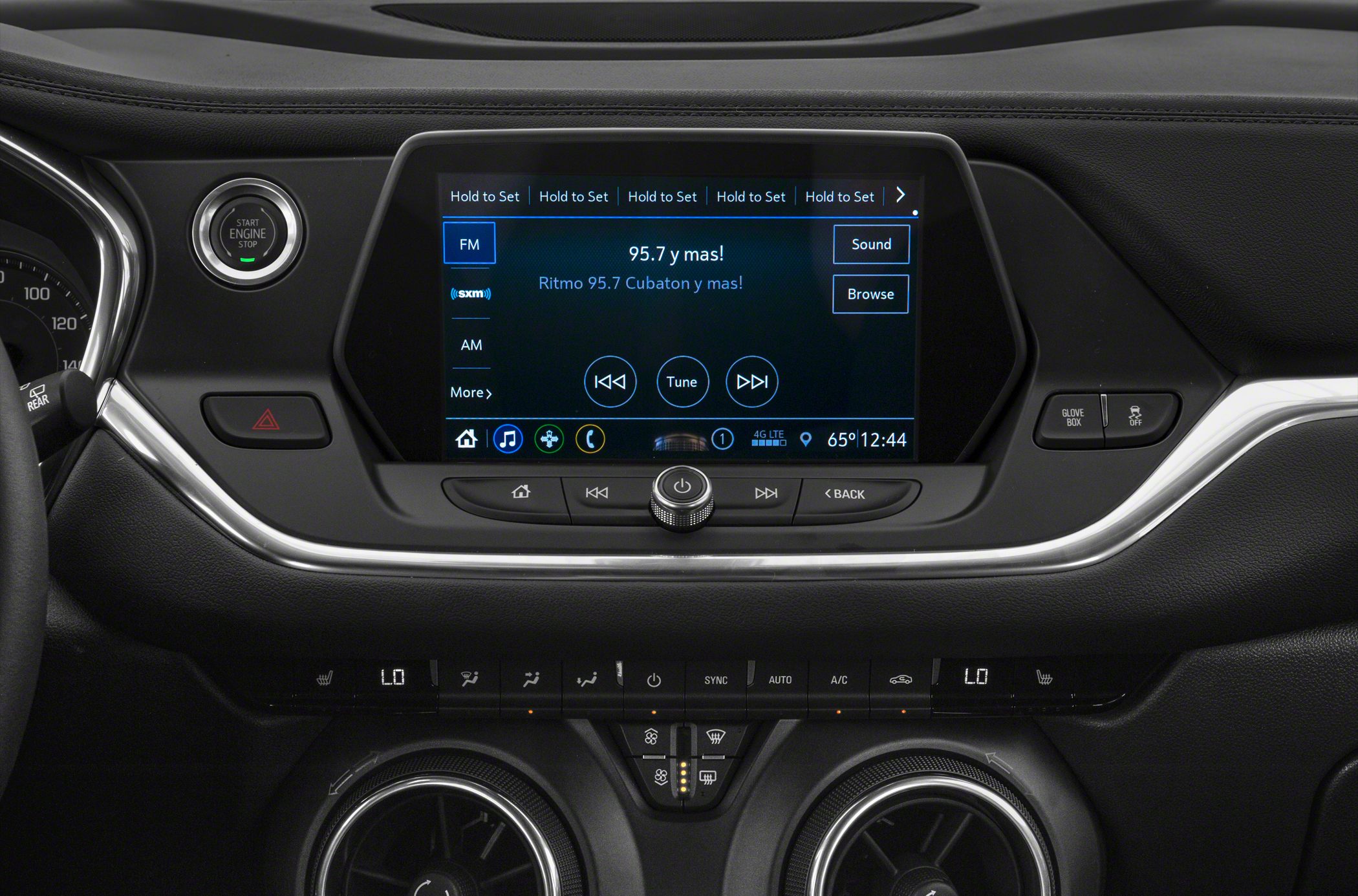 Infotainment touchscreen with audio controls and dual-zone climate system with circular vents