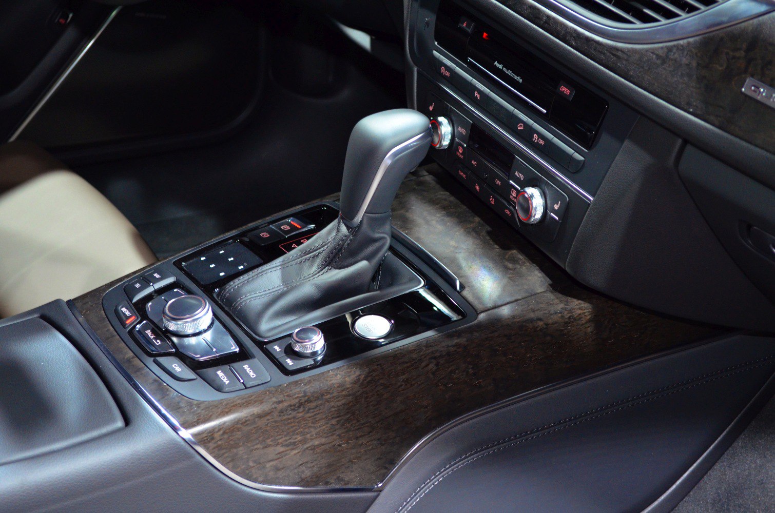 Center console with gear shift and multimedia controls