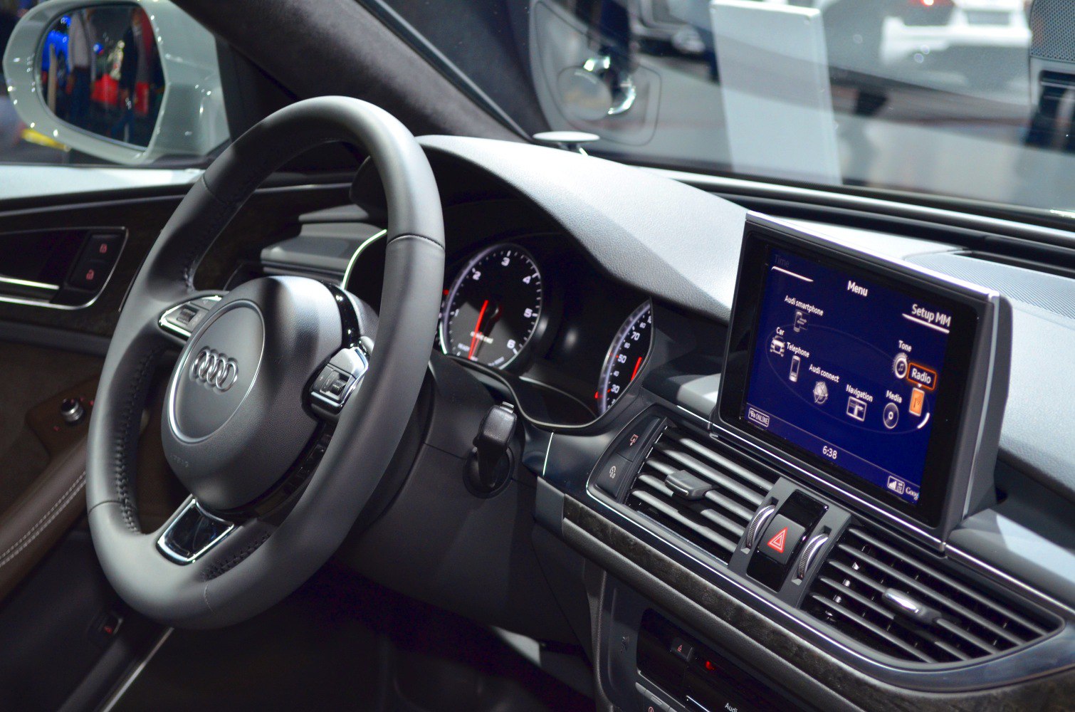 Audi A6 interior dashboard with steering wheel and infotainment display