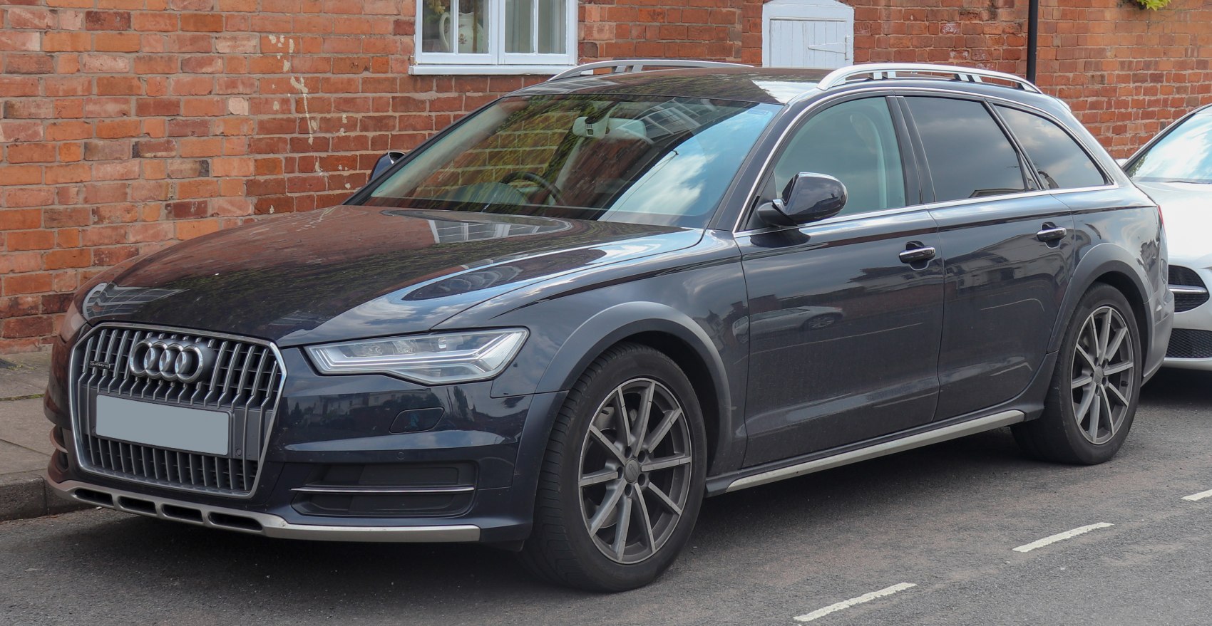 Elevated luxury wagon with rugged exterior features and alloy wheels