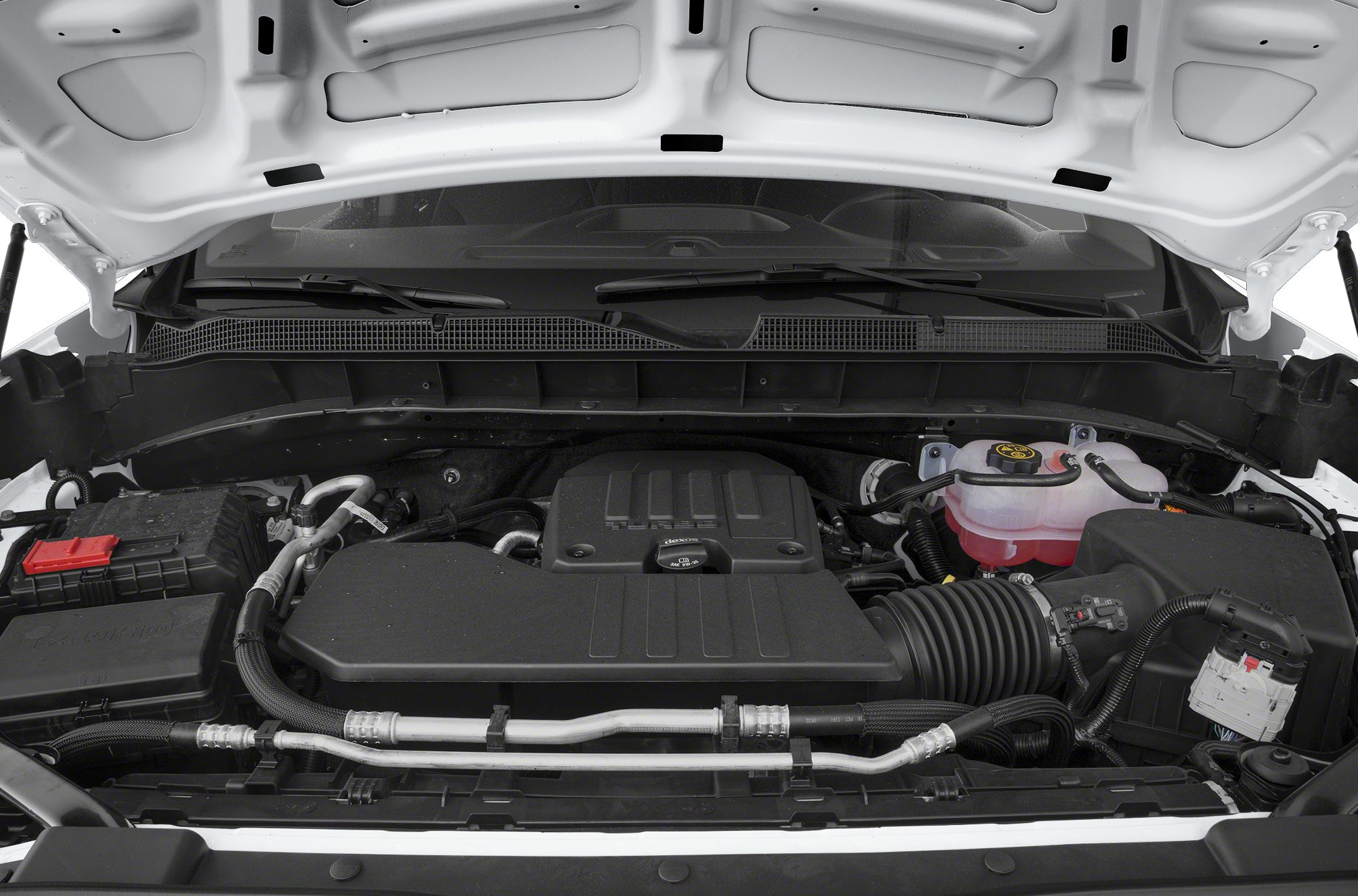 Engine compartment with modern components and fluid reservoirs.