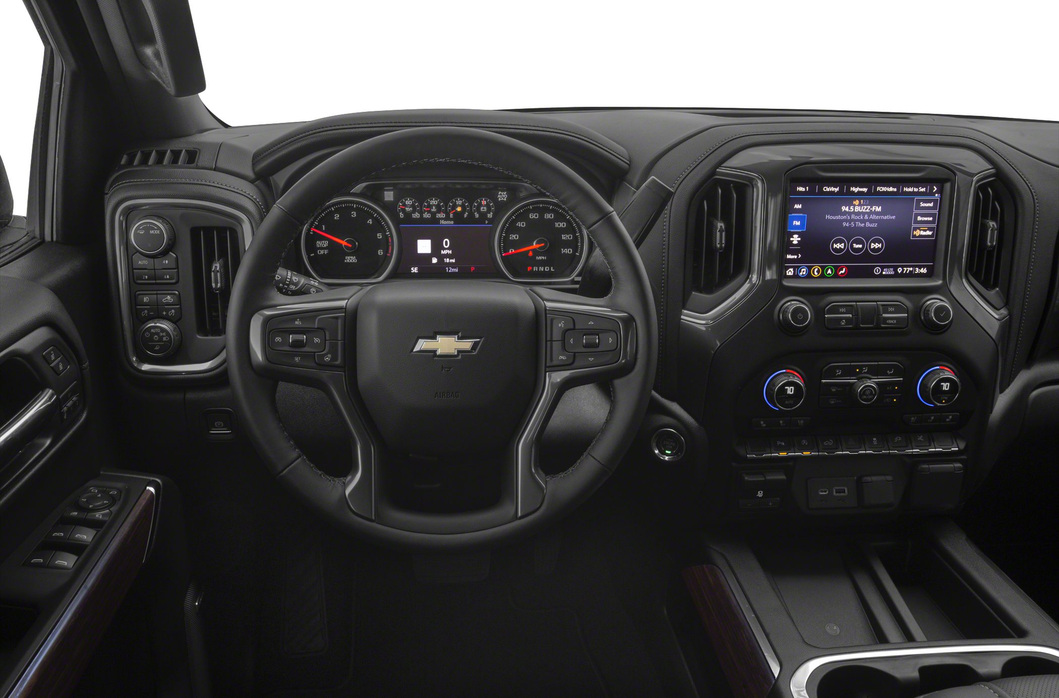 Steering wheel, digital-analog gauge cluster, touchscreen infotainment system