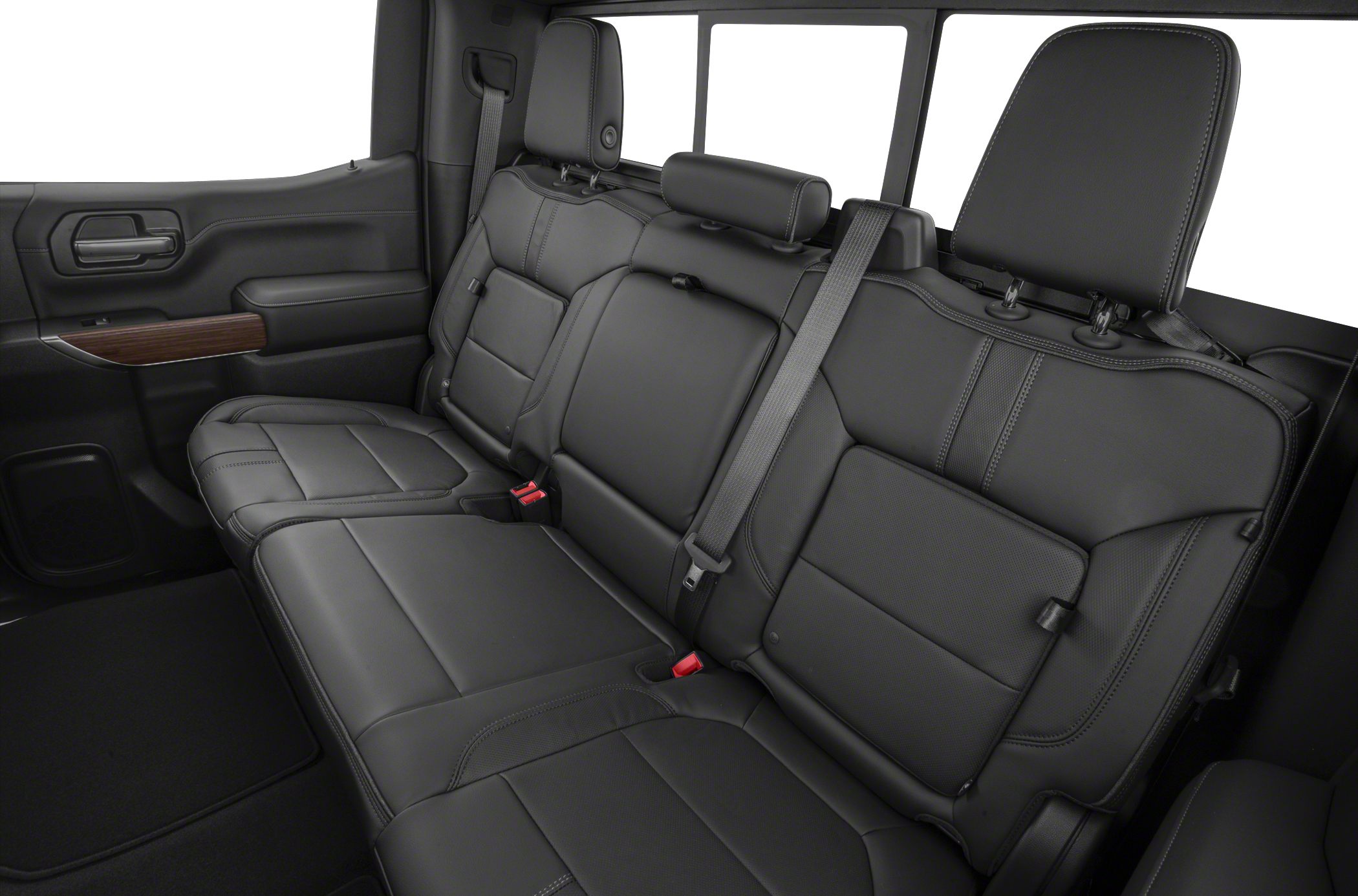 Spacious rear seat interior with black leather upholstery and headrests.
