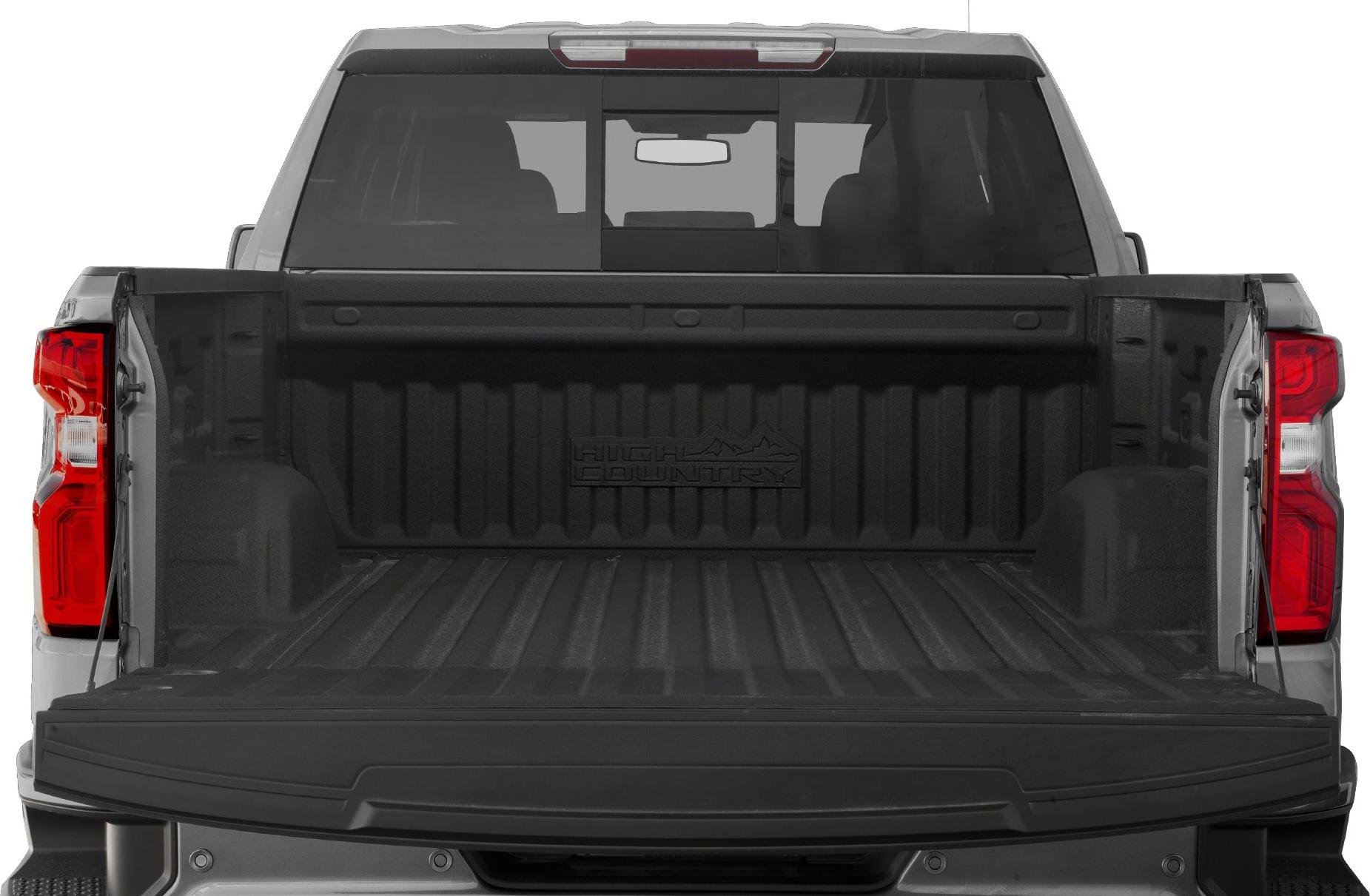 Open truck bed with tailgate down, showing ribbed liner and rear window.