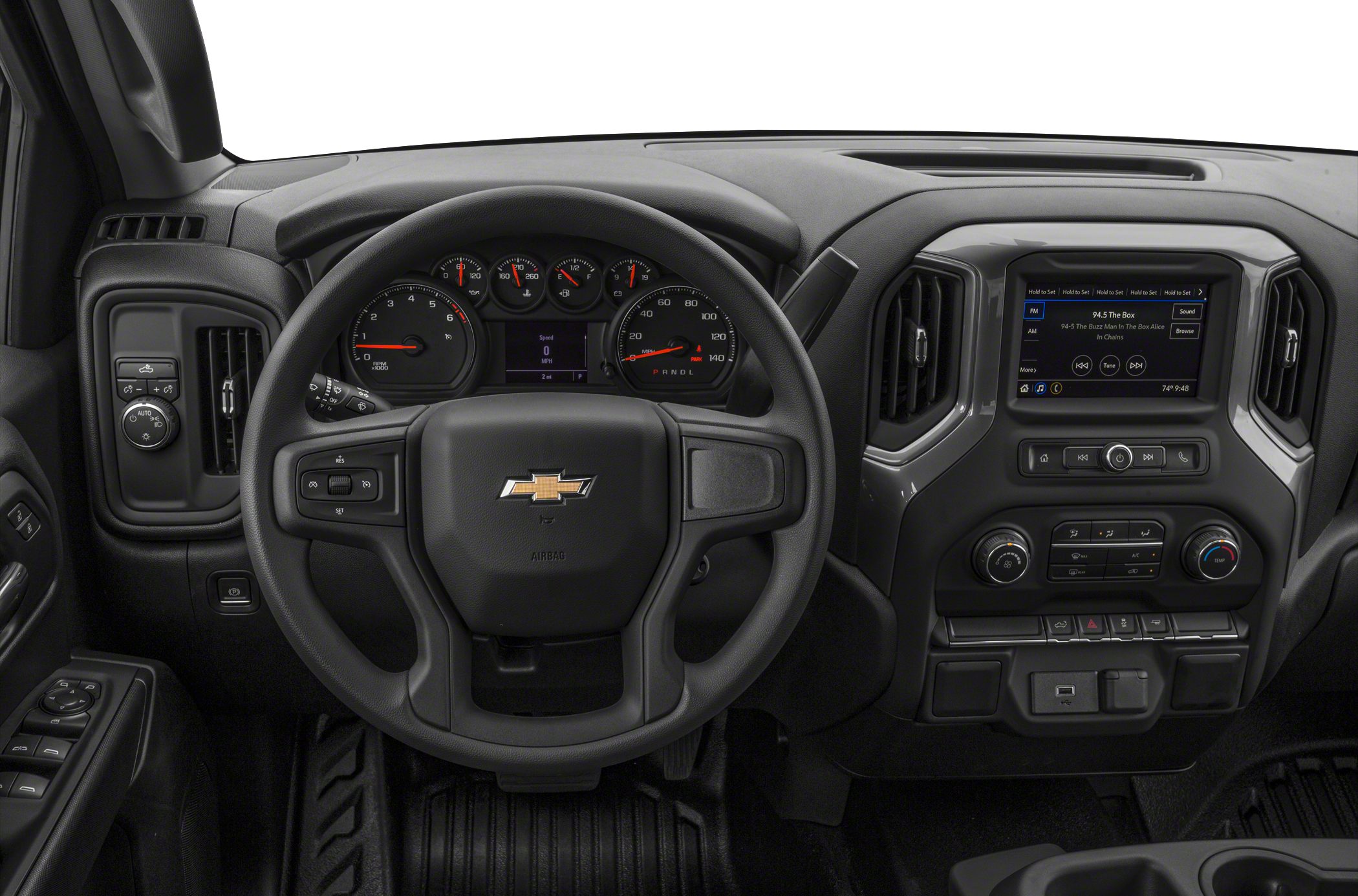 Dashboard with steering wheel, instrument cluster, and infotainment screen