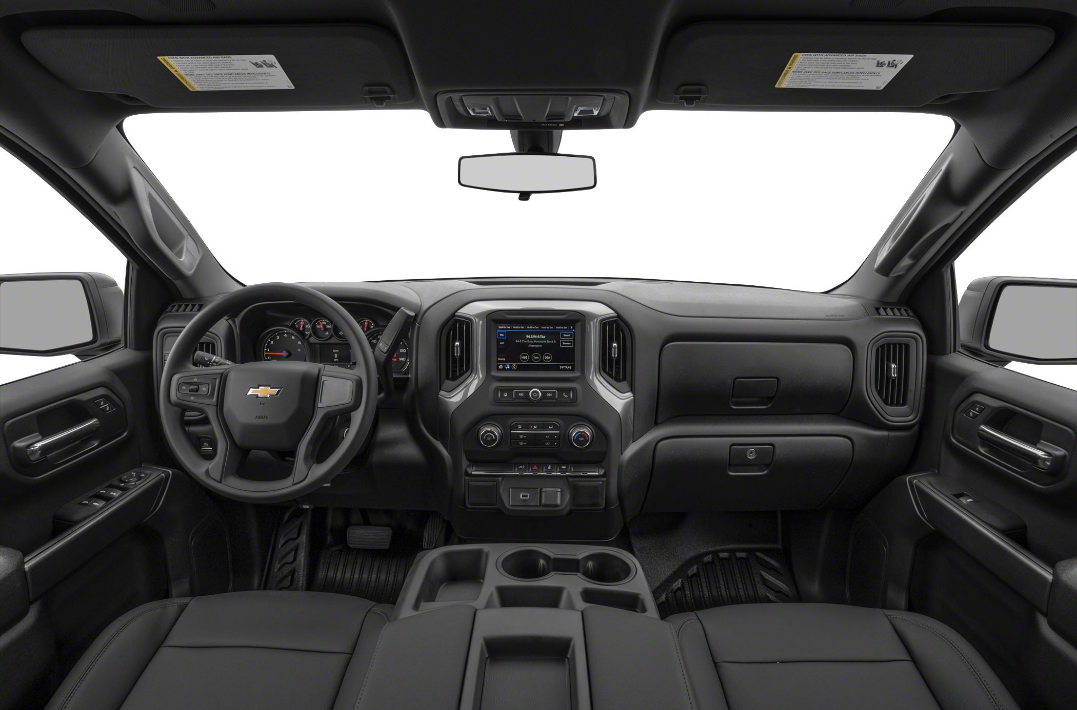 Dashboard and steering wheel with infotainment system and controls in black interior.