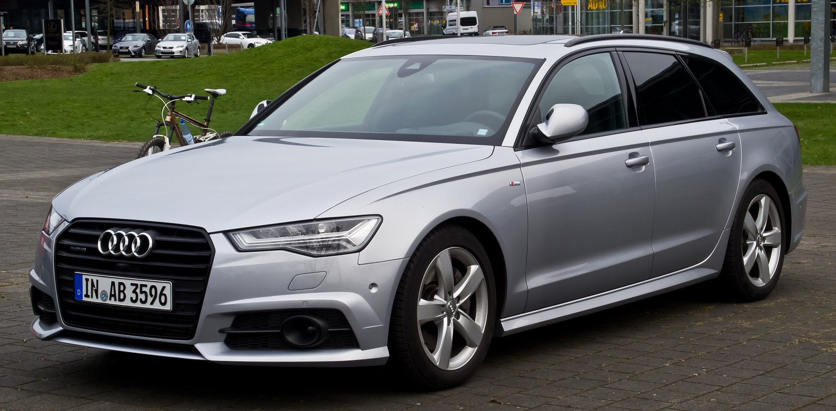 Silver station wagon with distinctive headlights and sporty alloy wheels