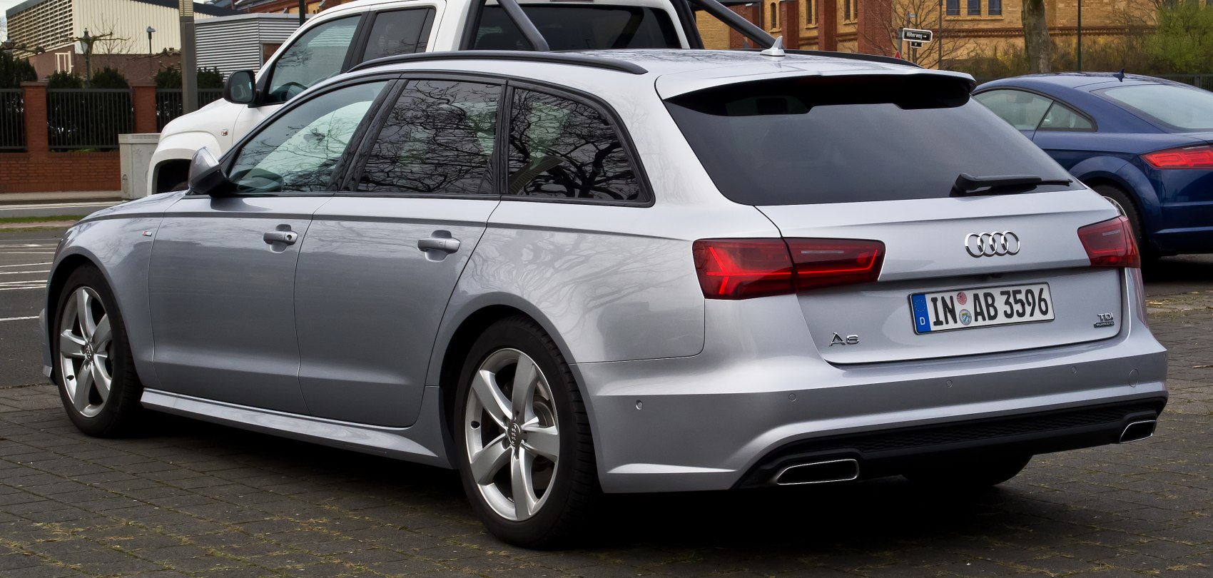 Silver Audi estate car rear side profile with LED tail lights