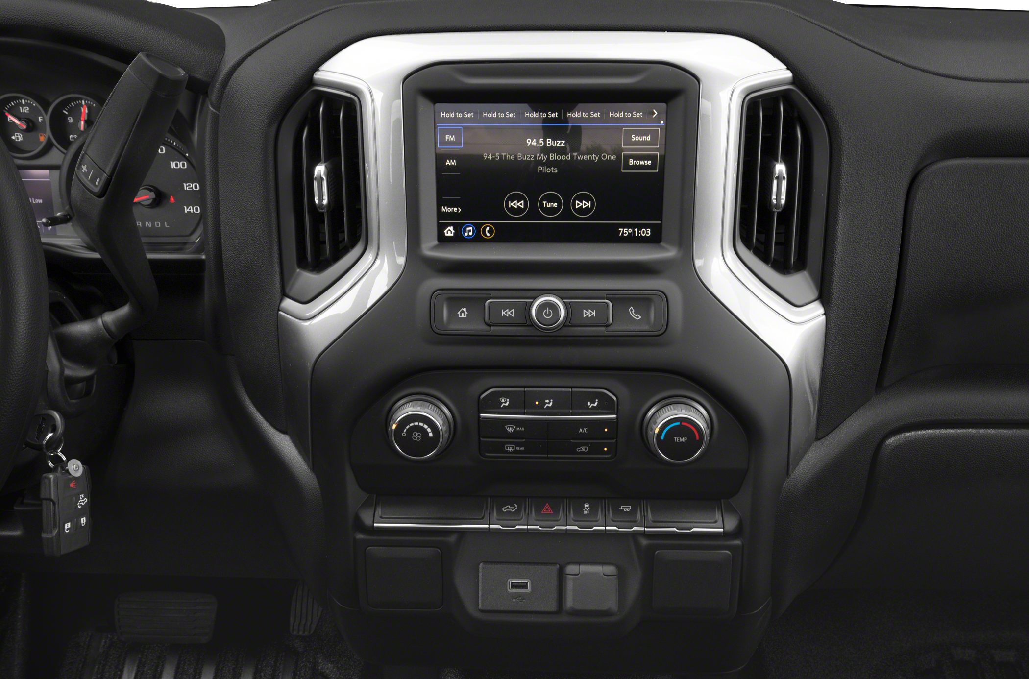 Dashboard and infotainment system with climate controls and vents