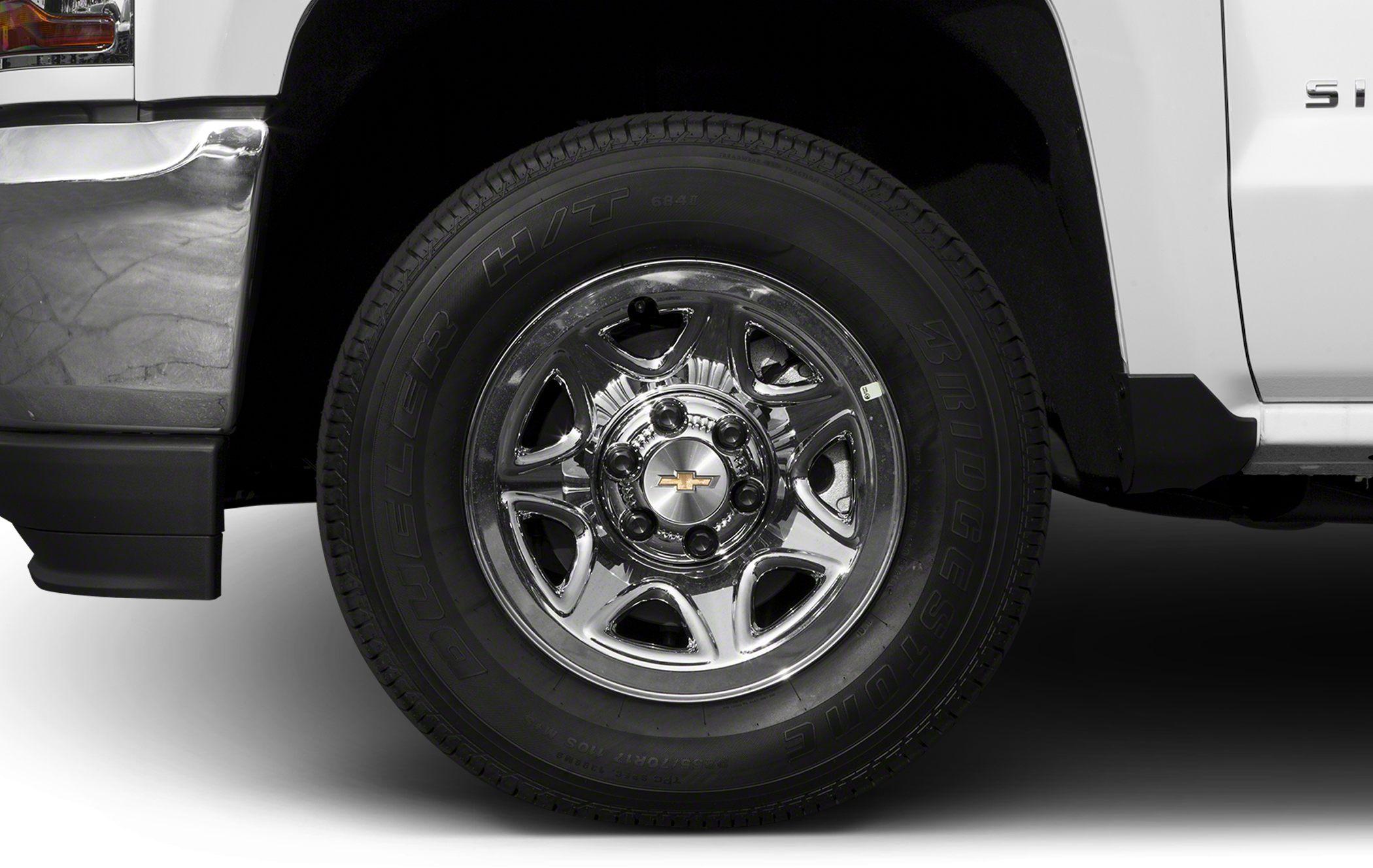 Chrome wheel with Bridgestone Dueler H/T tire on pickup truck