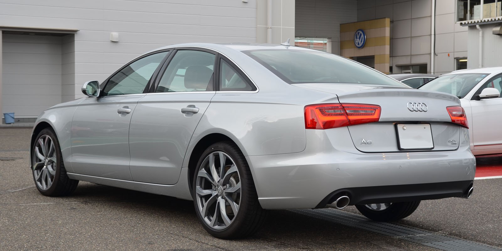Rear and side profile with dual exhaust and alloy wheels