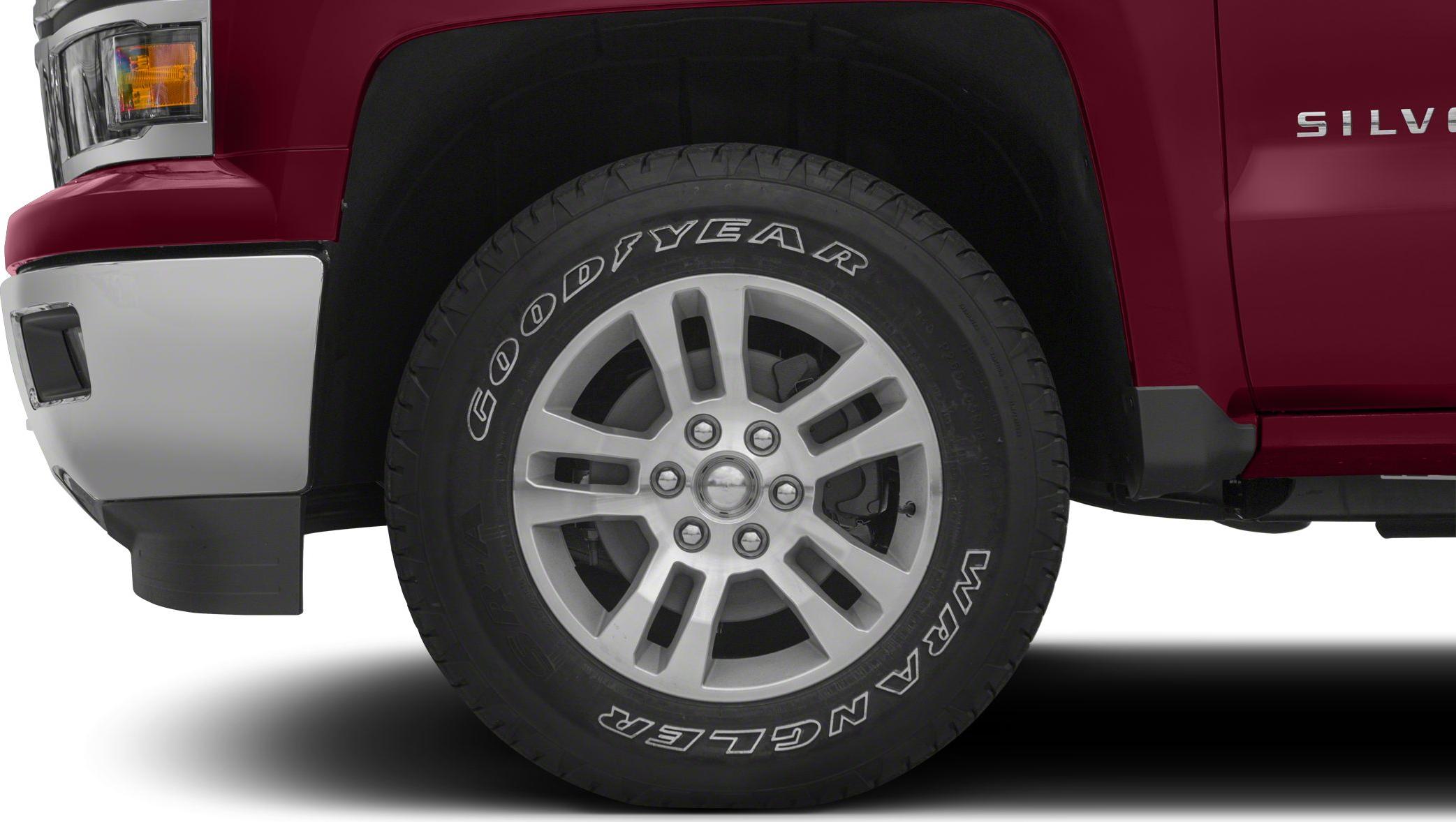 Front wheel alloy rim with Goodyear Wrangler tire on pickup truck