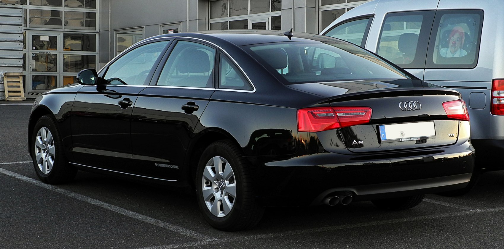 Rear-side view of sleek Audi A6 Sedan with distinctive taillights