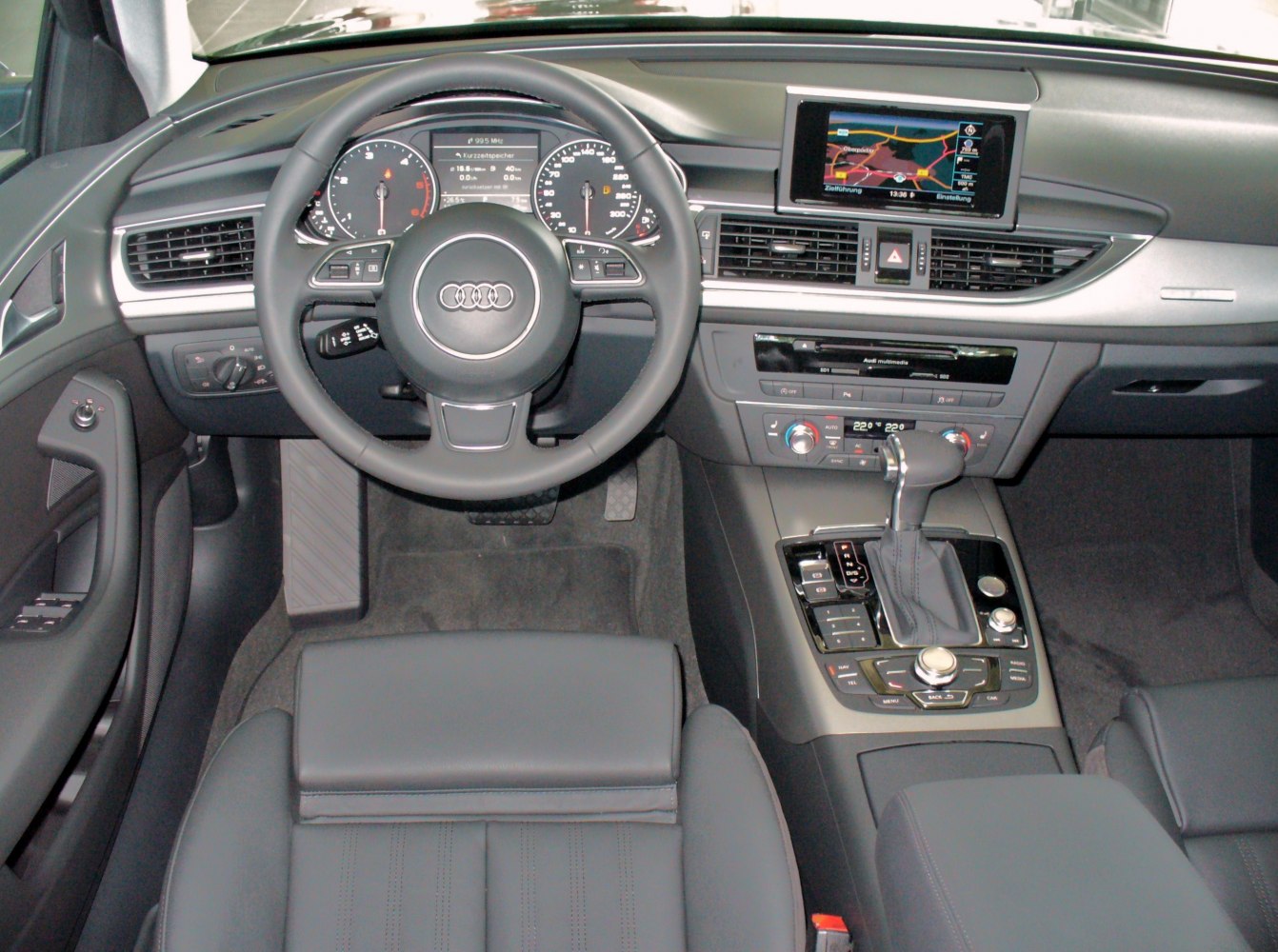 Steering wheel, dashboard, and center console with multimedia screen