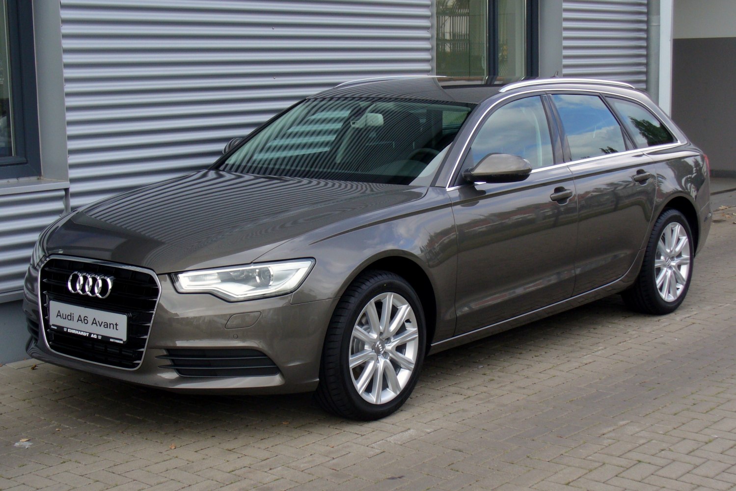 Front side view of sleek station wagon with alloy wheels