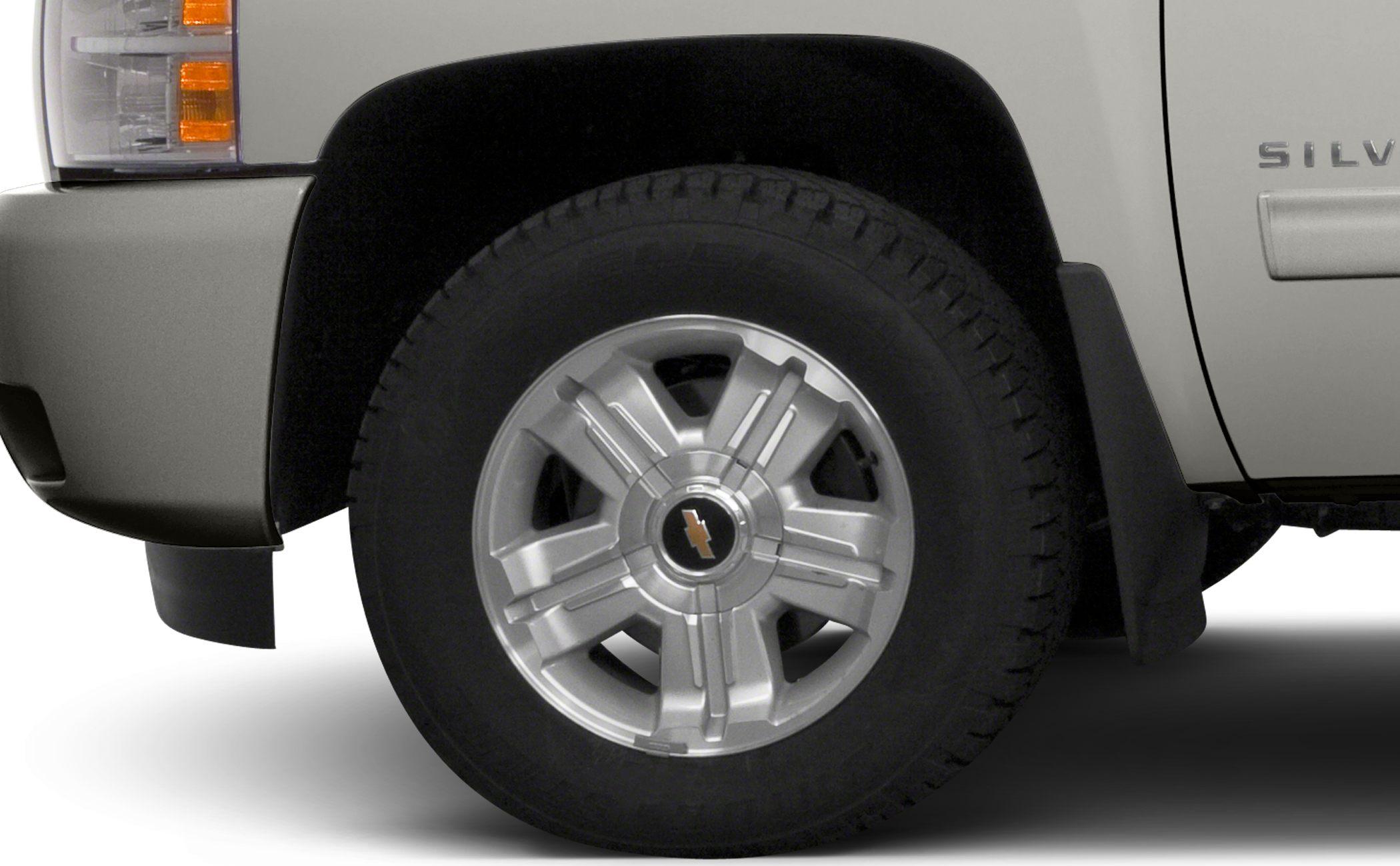 Alloy wheel and tire close-up with fender and mud flap