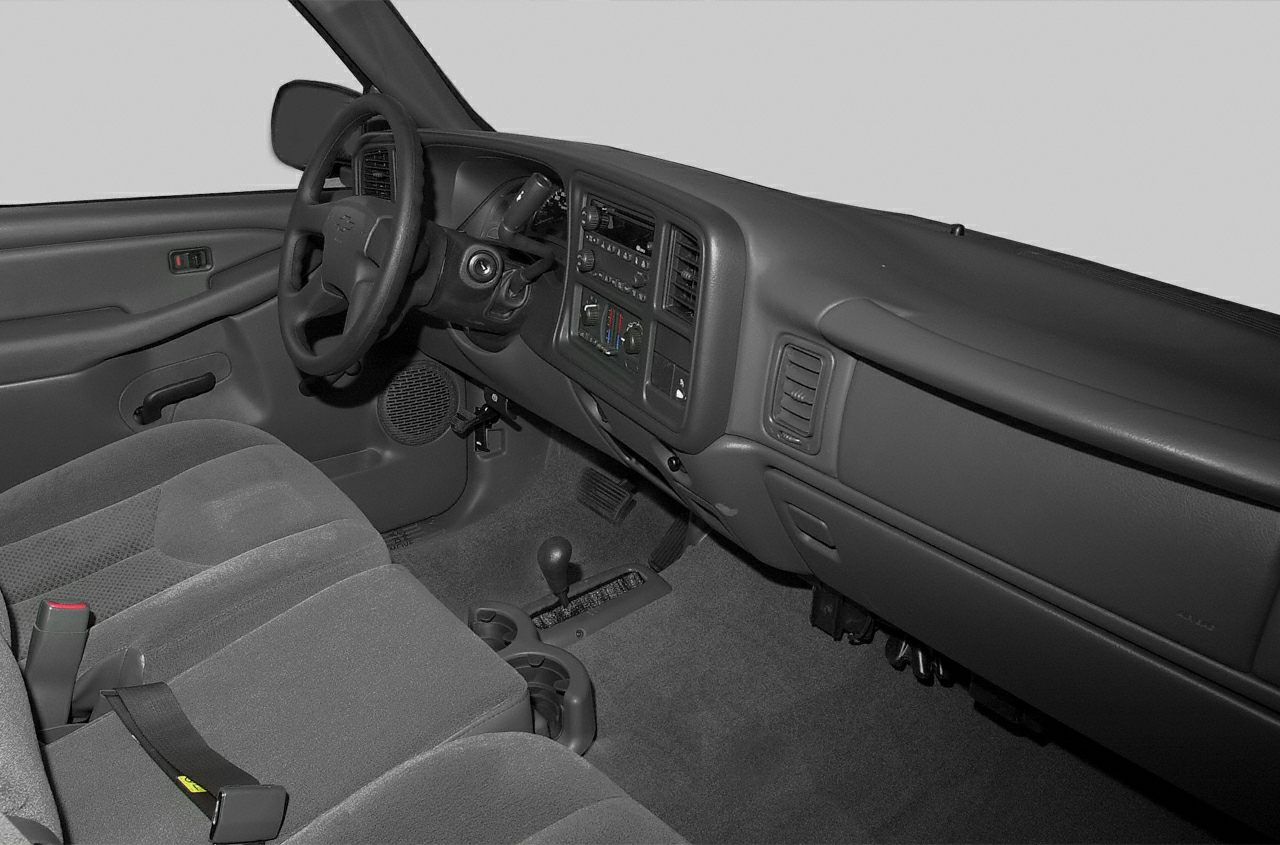 Interior dashboard, steering wheel, and seating of a pickup truck