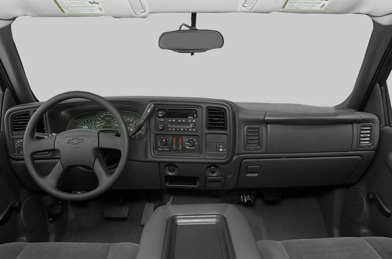 Dashboard and steering wheel with central console and air vents