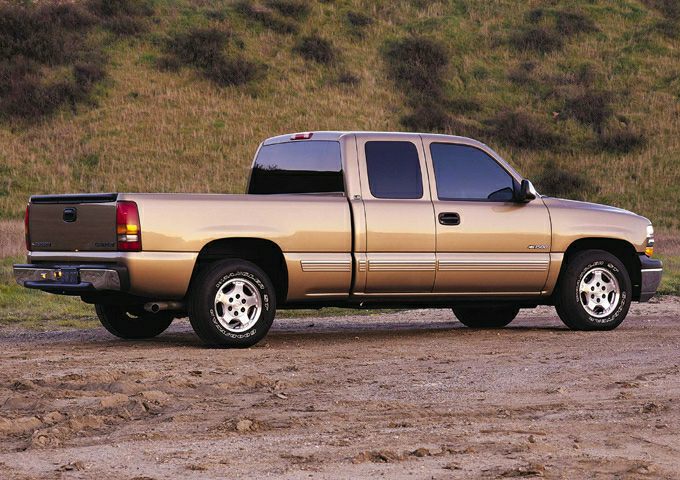 Side view of extended cab pickup with four doors and truck bed