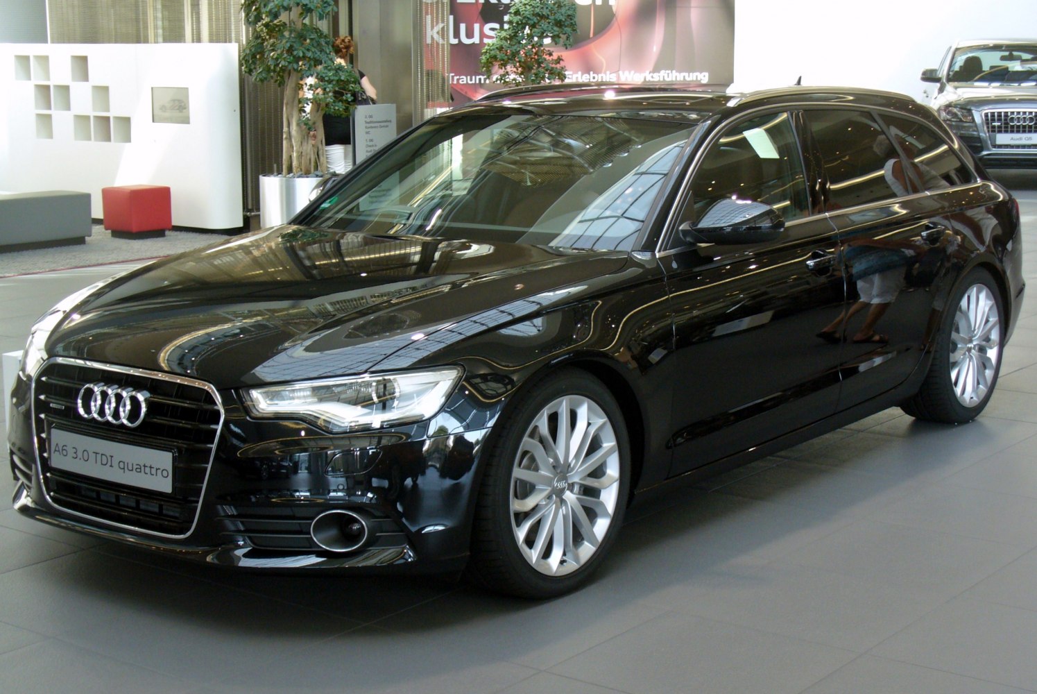 Front angled view of luxury wagon with LED headlights and alloy wheels