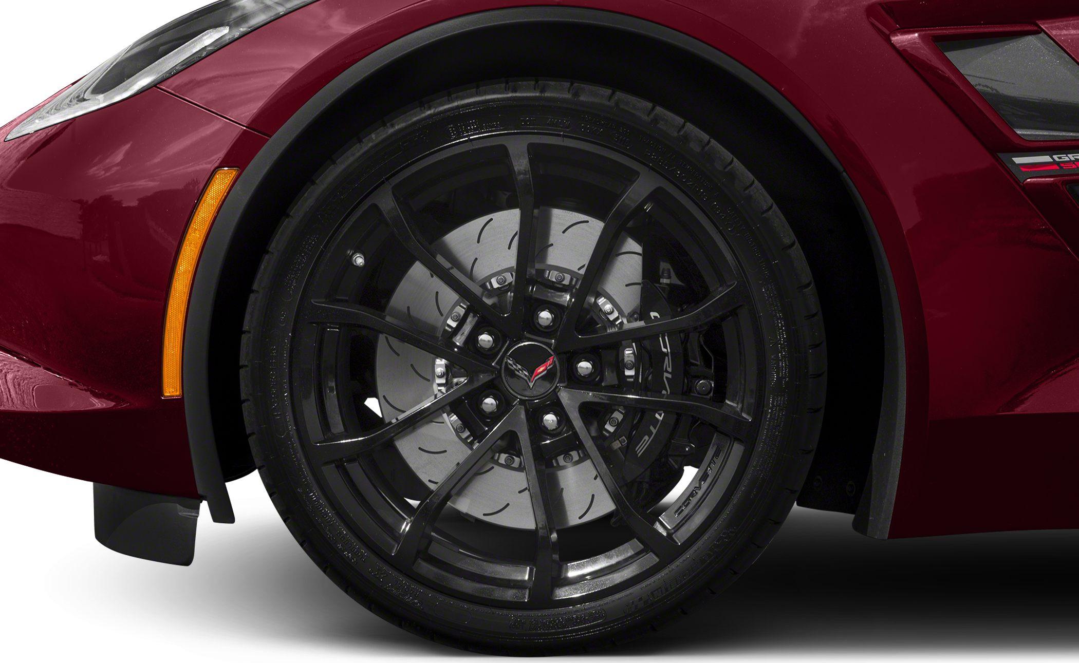 Black multi-spoke alloy wheel with slotted brake disc and Corvette brake caliper