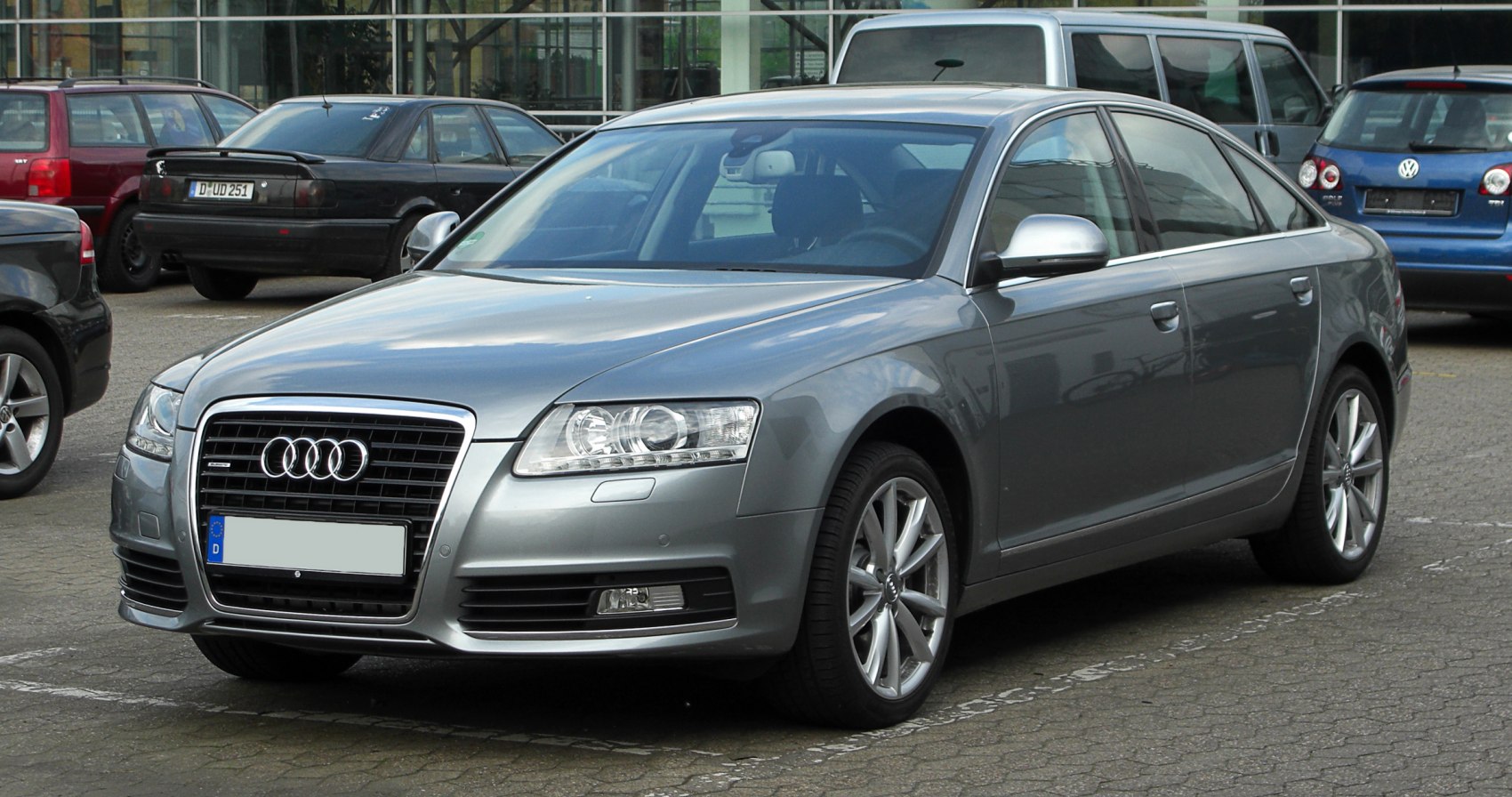 Front three-quarter view of a sedan with distinctive grille and alloy wheels