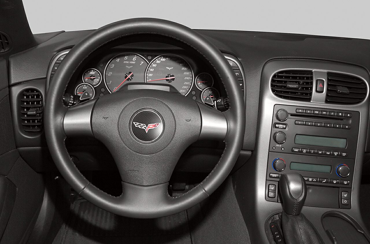 Black interior dashboard with steering wheel and center console controls