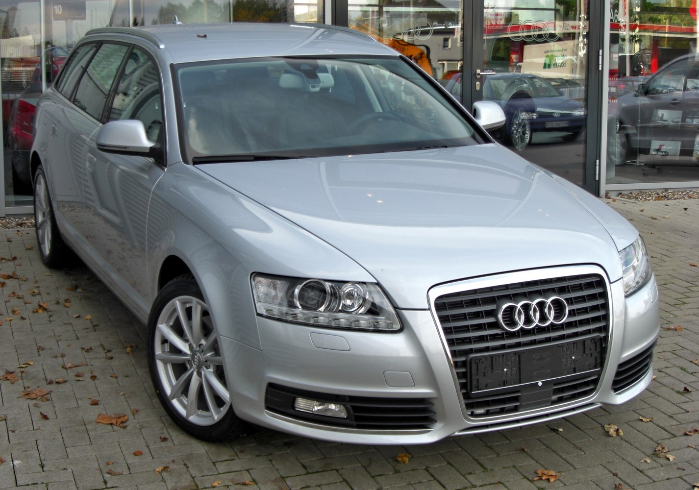Silver luxury wagon with chrome grille and modern headlights