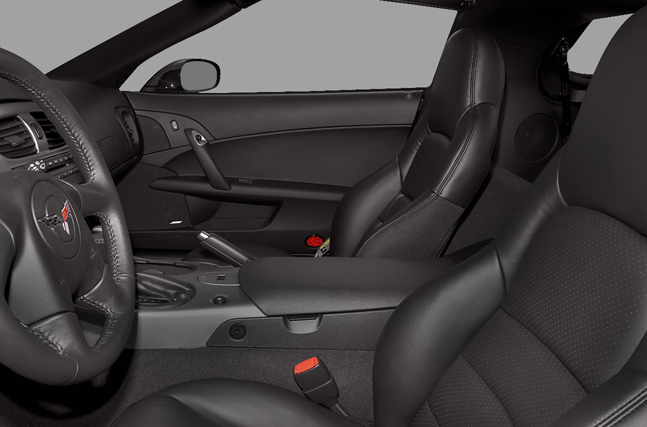 Black leather seats and sporty cockpit interior with steering wheel and gear shifter