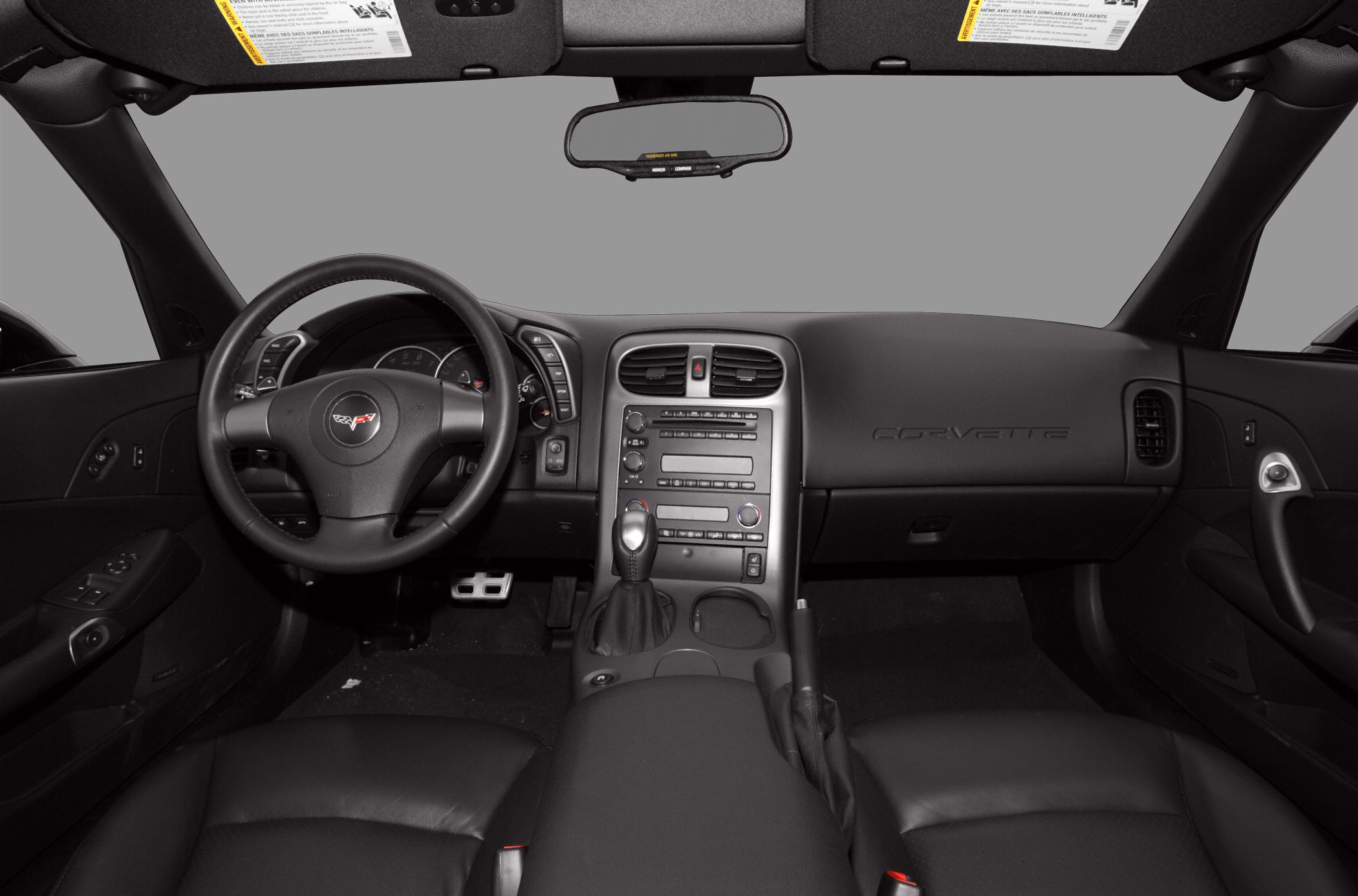 Interior view with dashboard, steering wheel, and center console.