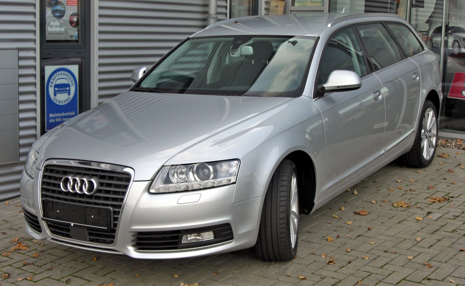 Silver station wagon with distinctive grille and headlights.