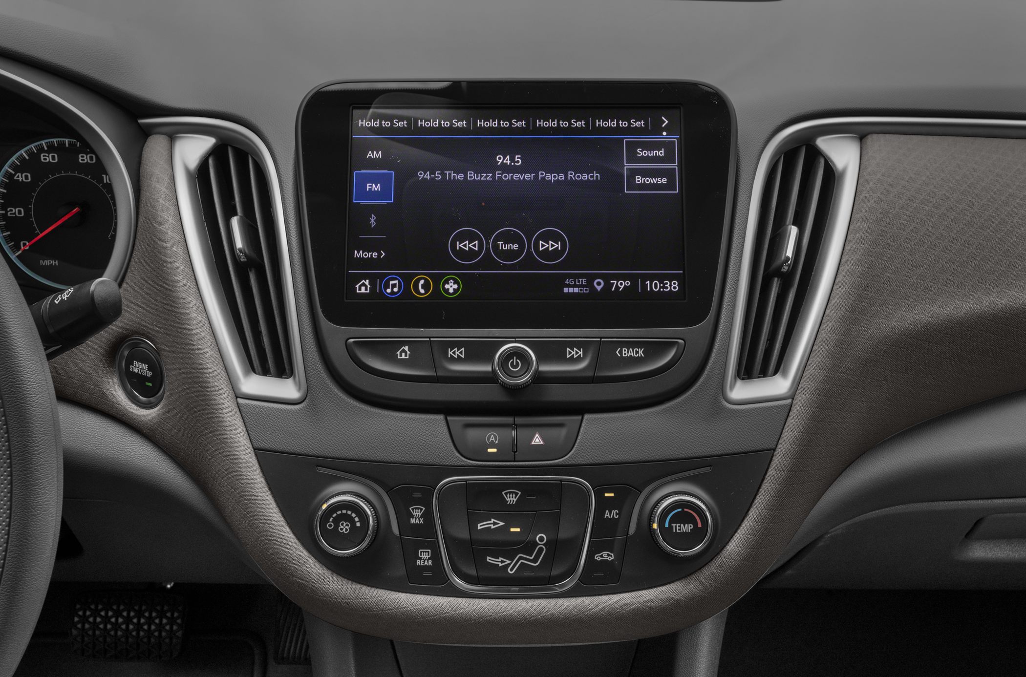 Central infotainment touchscreen and climate control system in car interior