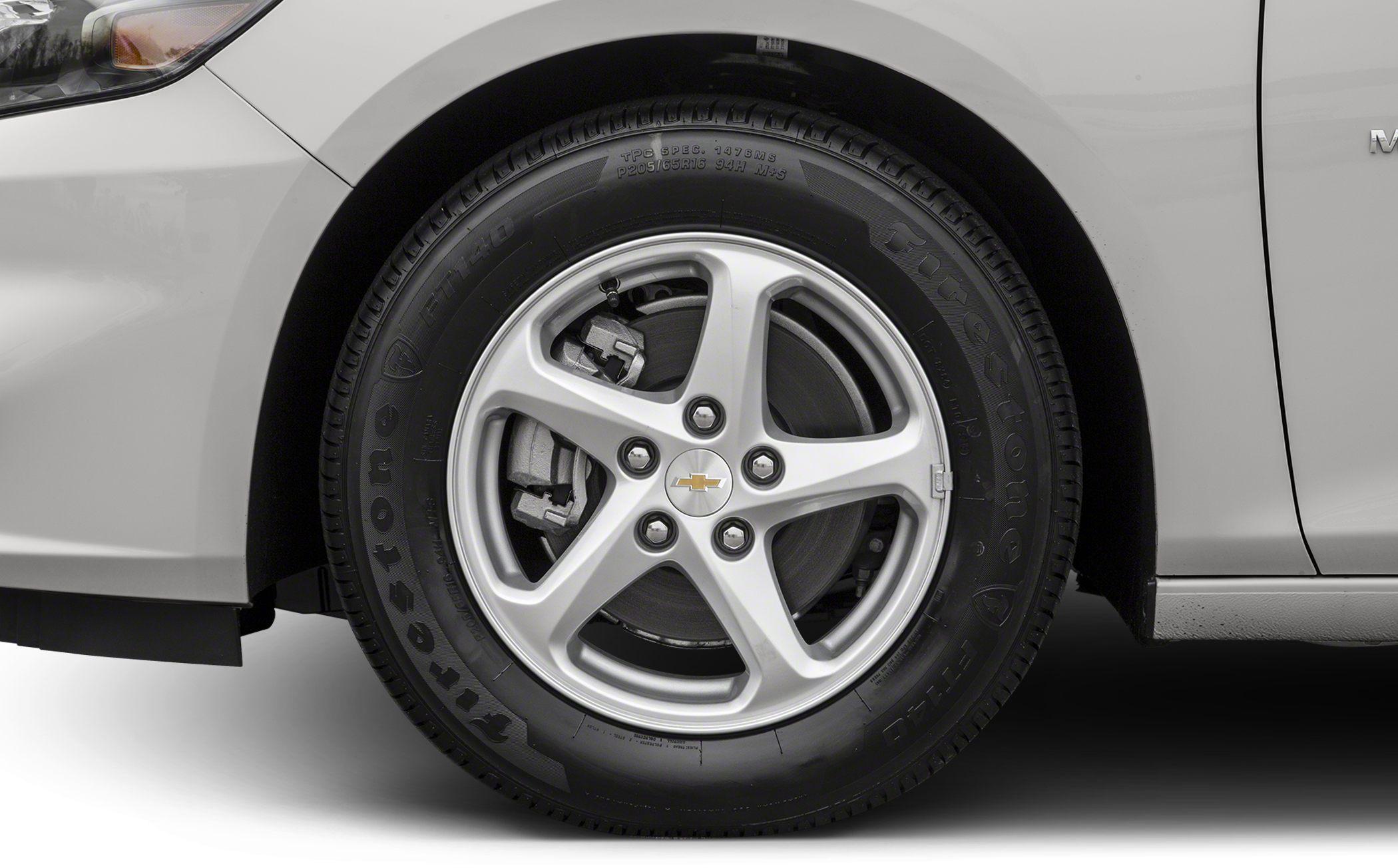 Alloy wheel with five spokes and visible brake caliper behind rim