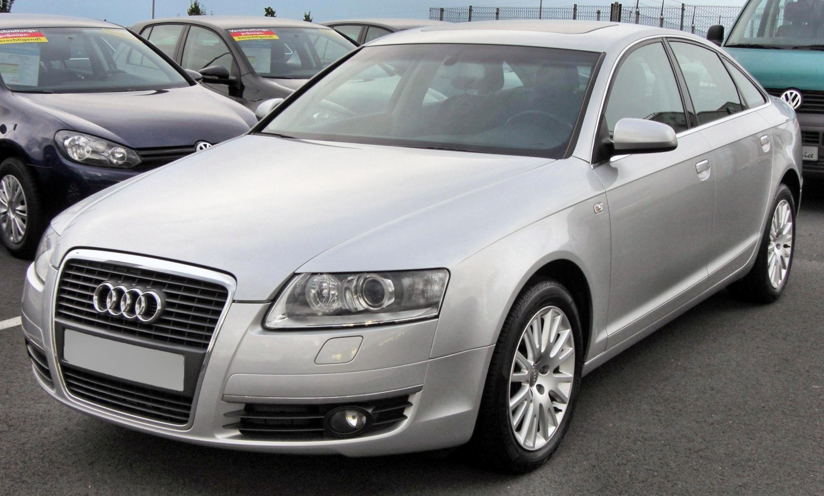 Front grille and dual headlight design on a 2005 sedan.