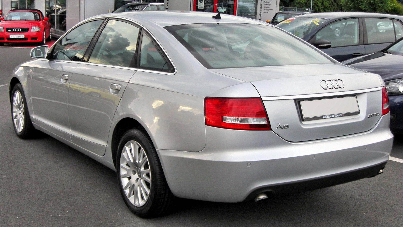 Silver sedan rear view with sharp tail lights and clean bumper