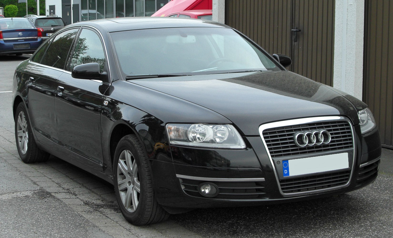 Sedan front three-quarter view with grille and headlights