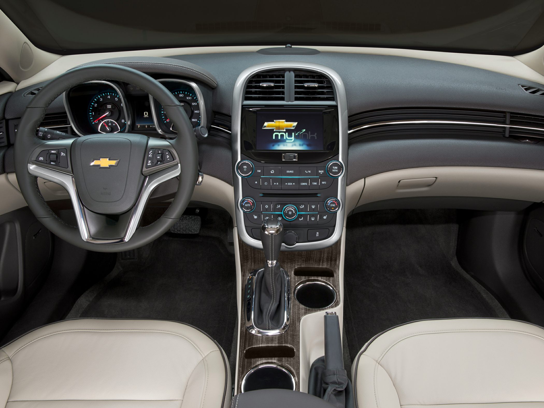 Modern dashboard, steering wheel with controls, and center console with infotainment